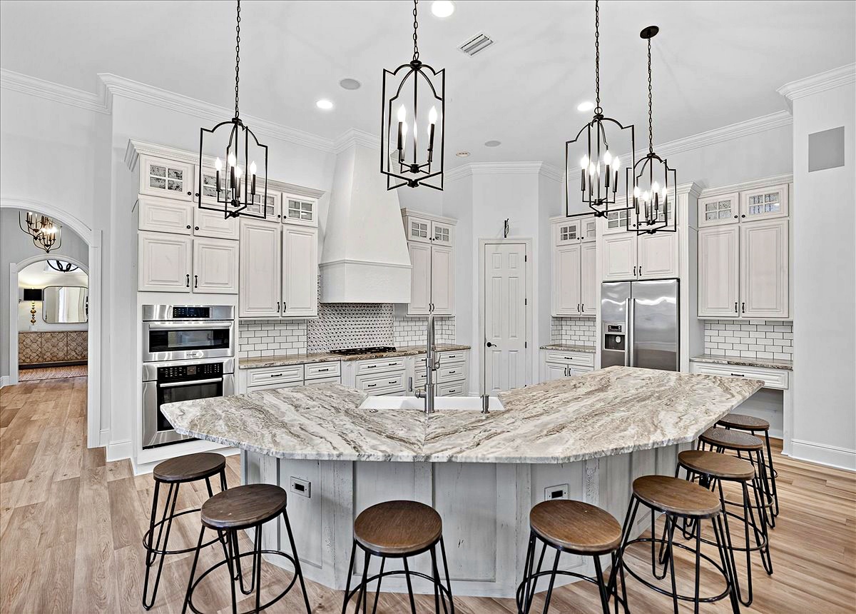 Kitchen with stone island at 3161 Club Drive