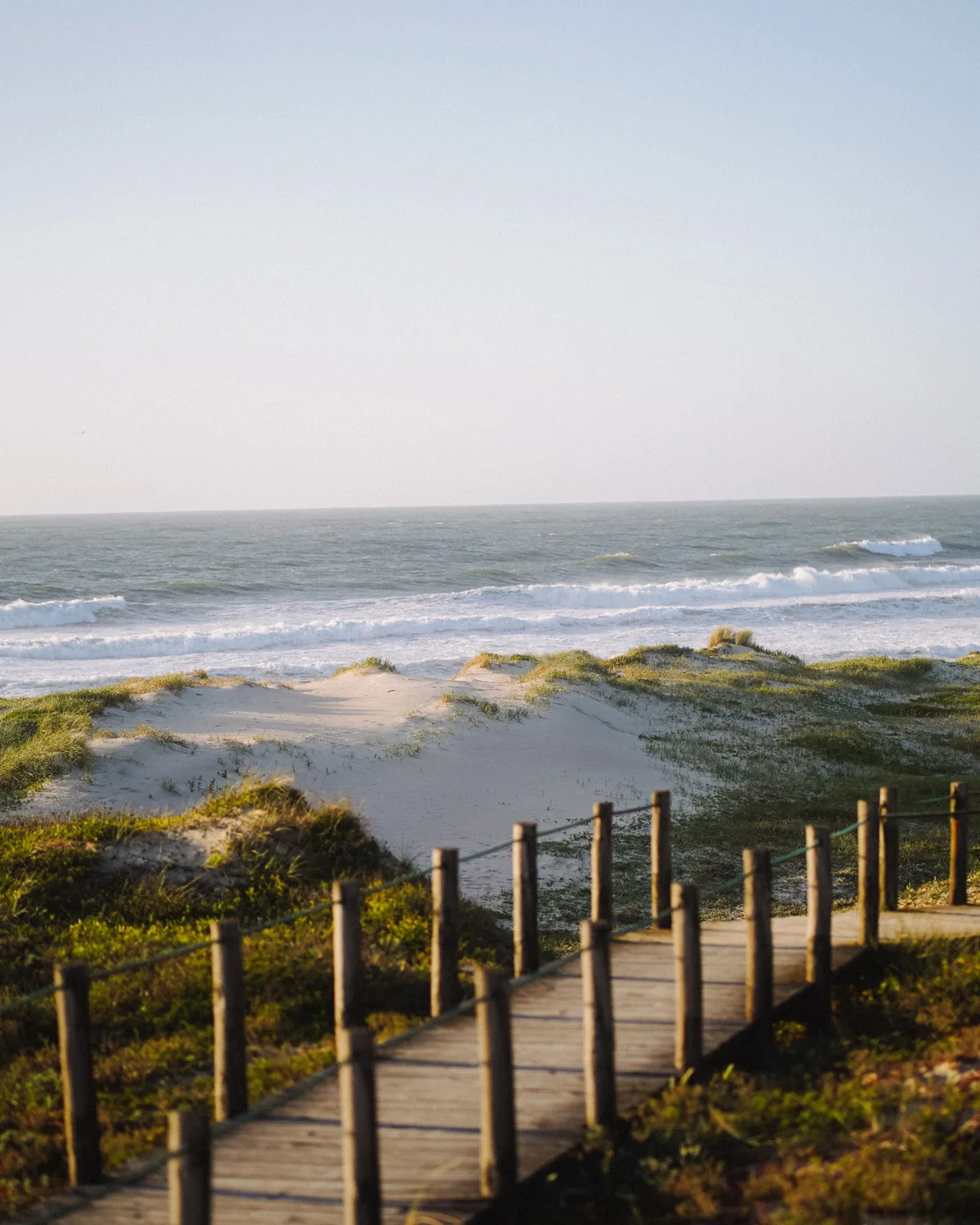 Boardwalk leading to a white sand beach along 30A